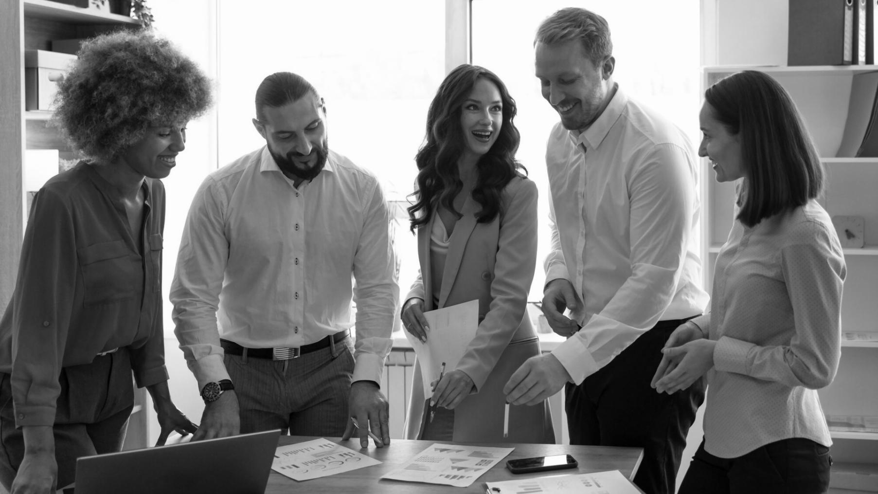 Business professionals reviewing financial documents and budget planning materials